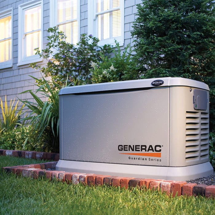 Technician from Generator Supercenter of Boston professionally installing a standby generator outdoors.