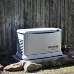 A licensed electrician meticulously installs a generator system with an automatic transfer switch that runs on natural gas