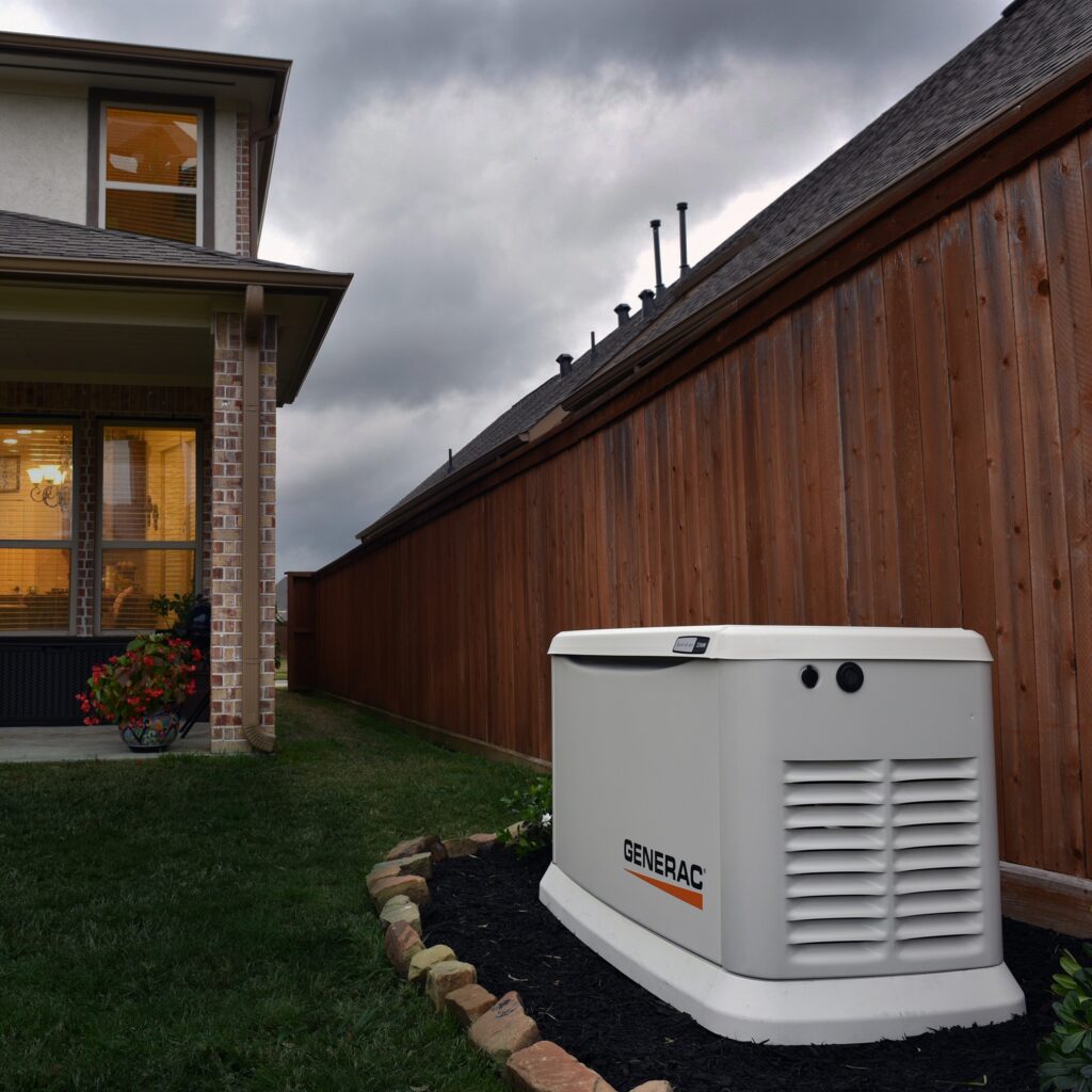 A Generac Home Standby Generator on a concrete slab, sized for essential appliances & power outage expectancy in MA